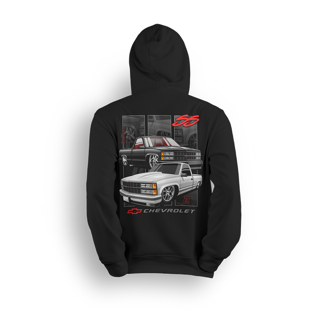 Dual Threat 454 SS hoodie featuring a blacked-out 454 SS and a clean white single cab, both dropped low with classic Chevy muscle style. Red interior accents, bold Chevrolet badge, and subtle interior panels complete this yin-yang inspired custom truck design.