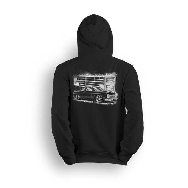 Hoodie featuring a black Squarebody C10 dropped low with a stylized illustration of its iconic front end in the background. Bold Chevy vibes, clean stance, and street-ready attitude make this hoodie a true nod to the custom truck scene.