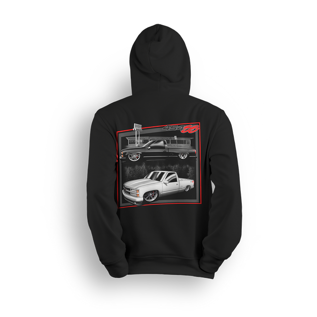 Hoodie featuring two slammed OBS Chevy trucks side by side one black at the pump and one white ready to roll. Framed in red and full of street style, the Double Trouble hoodie brings bold energy for true custom truck fans.