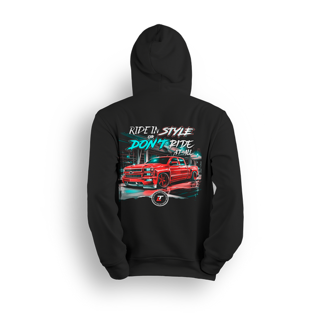Hoodie featuring a fire-red slammed Chevy with glossy black wheels under city lights, accented by neon strokes and bold urban glow. “Ride in Style or Don’t Ride at All” text up top makes this hoodie a statement for bold builders and late-night cruisers.