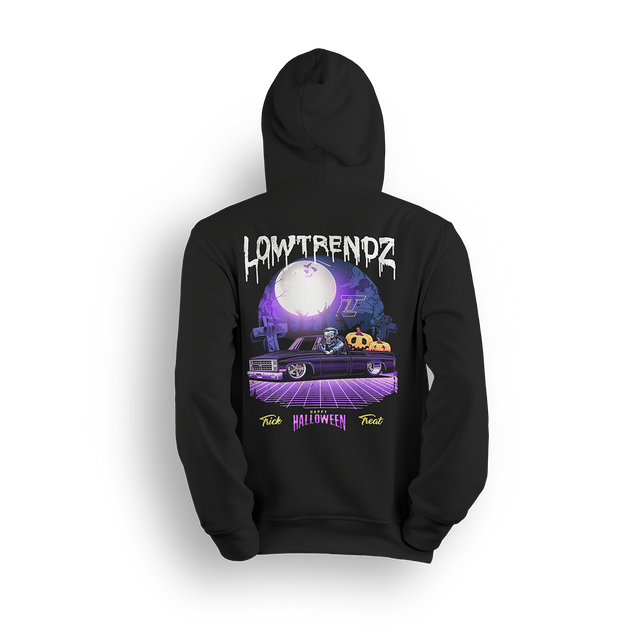 Halloween hoodie featuring a slammed Squarebody in a graveyard at night with a full moon and skeleton behind the wheel