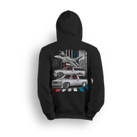 Hoodie featuring Mike García’s slammed 1996 Chevy Tahoe in red, white, and blue with a fighter jet flying overhead. Inspired by his StreetTrucks Magazine build, the Maverick hoodie combines Pro Touring style, bold detail, and street-ready stance for standout presence.