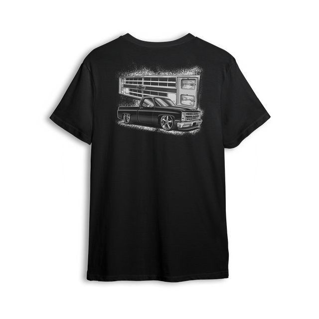 T-shirt featuring a black Squarebody C10 dropped low with a stylized illustration of its iconic front end in the background. Bold Chevy vibes, clean stance, and street-ready attitude make this t-shirt a true nod to the custom truck scene.