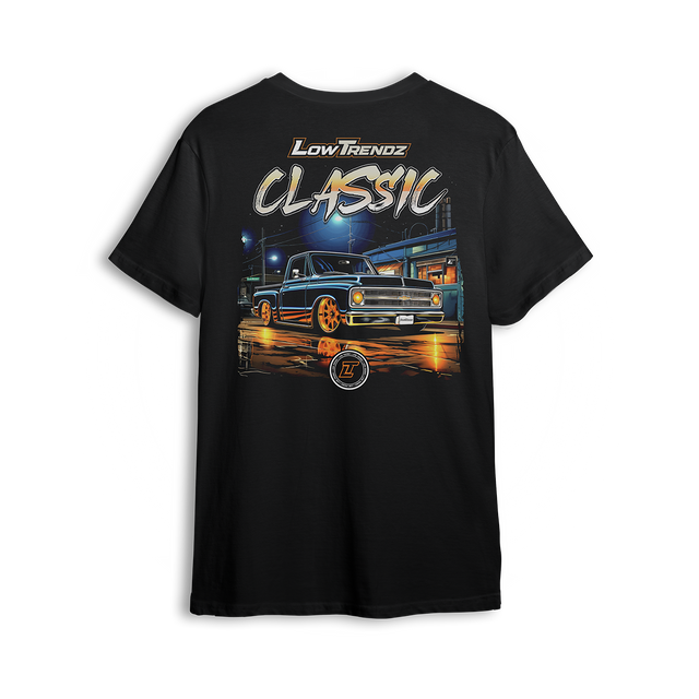 Classic Nights t-shirt featuring a gold-wheeled Squarebody cruising under city lights with glowing reflections. Bold Low Trendz Classic lettering makes this t-shirt a tribute to timeless builds and late-night rides in the custom truck scene.