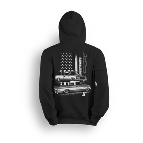 Hoodie featuring a slammed C10 and OBS combo with a gritty American flag backdrop and bold Low Trendz branding. Blending old-school style with street flex, this hoodie is built for true truck fans and show season vibes.