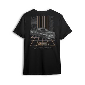 T-shirt featuring a murdered-out Chevy OBS laid out over a retro gold grid, with clean lines, bold stance, and vintage-inspired striping. This t-shirt pays homage to the golden era of custom trucks with smooth, standout style.