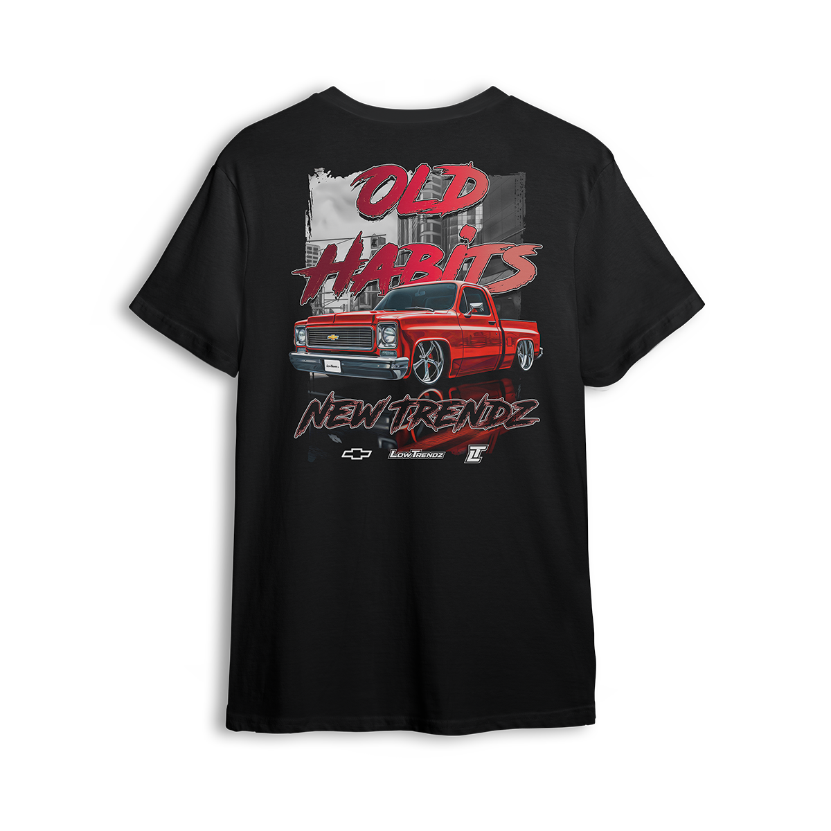 T-shirt featuring a fire red slammed Chevy Squarebody set against a gritty city backdrop with bold “Old Habits, New Trendz” lettering. This t-shirt blends classic attitude with modern style, made for builders who respect the roots and push the scene forward.