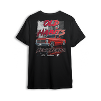 T-shirt featuring a fire red slammed Chevy Squarebody set against a gritty city backdrop with bold “Old Habits, New Trendz” lettering. This t-shirt blends classic attitude with modern style, made for builders who respect the roots and push the scene forward.