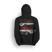 Hoodie featuring two slammed Chevy C10s—one silver, one red and white two-tone—laid out over a grid floor with a layered Low Trendz backdrop. The Two-Tone Royalty hoodie blends vintage muscle with custom show truck style for builders who keep it classic, not basic.