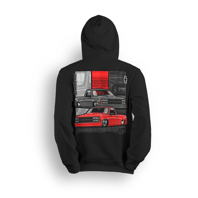 Hoodie featuring two slammed OBS Chevys in black and red over a bold tri-panel backdrop with a vertical CHEVROLET graphic and red bowtie. The Redline Revival hoodie is a high-impact tribute to iconic Chevy style and custom truck lifestyle.