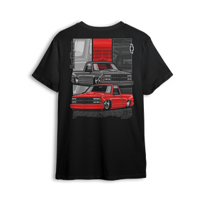 T-shirt featuring two slammed OBS Chevys in black and red over a bold tri-panel backdrop with a vertical CHEVROLET graphic and red bowtie. The Redline Revival t-shirt is a high-impact tribute to iconic Chevy style and custom truck lifestyle.