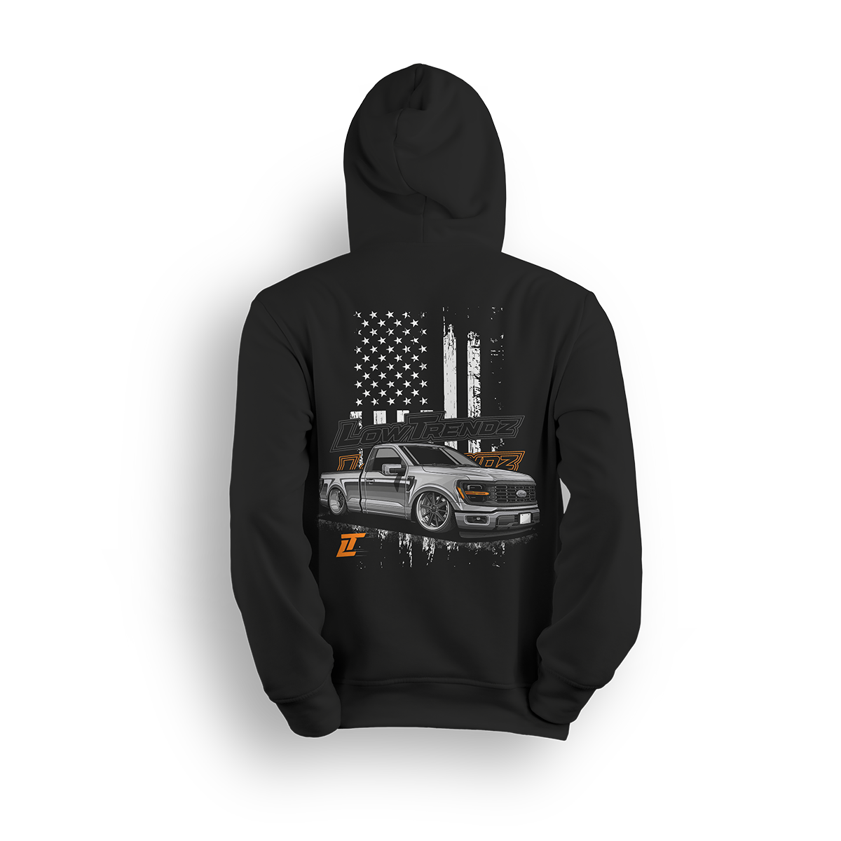 Hoodie featuring a slammed, murdered-out single cab Ford F-150 in front of a distressed American flag with burnt orange Low Trendz branding. The Stars, Stripes & Stance hoodie delivers bold Ford energy and custom street presence for true lifestyle reps.