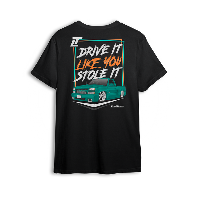 T-shirt featuring a slammed teal Chevy Silverado with a bold street stance and retro-style typography reading “Drive It Like You Stole It.” Set on a premium black tee with vibrant colors, this t-shirt captures loud custom energy and lead foot attitude.