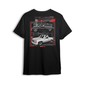 T-shirt featuring two slammed OBS Chevy trucks side by side one black at the pump and one white ready to roll. Framed in red and full of street style, the Double Trouble t-shirt brings bold energy for true custom truck fans.