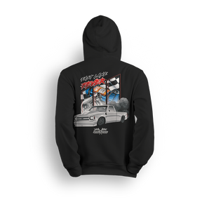 Hoodie featuring a slammed white Chevy C10 squatting low with smoke and torque, backed by racing visuals, nitrous bottles, and checkered flags. The Fast Lane Fever hoodie is built for drag racers and adrenaline junkies chasing speed and chaos.