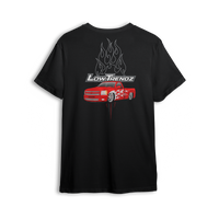 T-shirt featuring a slammed red Chevy truck with silver hot-rod flames down the sides and chrome flames bursting behind an oversized Low Trendz logo. The Flame Drop t-shirt brings high-octane energy and bold street presence.