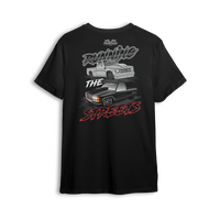 T-shirt featuring a slammed silver C10 and murdered-out OBS truck in a bold drag-ready layout with burnout marks and street-style font. The Running the Streets t-shirt captures boosted attitude, full-send energy, and late-night racing vibes.
