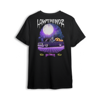 Halloween t-shirt featuring a slammed Squarebody in a graveyard at night with a full moon and skeleton behind the wheel