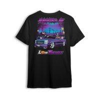 Black t-shirt with spooky Halloween artwork of a slammed Chevy Silverado in graveyard scene with skeleton driver and jack-o-lanterns