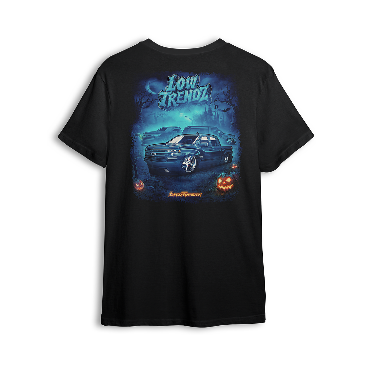 Halloween 2025 t-shirt featuring a slammed Chevy truck, glowing jack-o’-lanterns, and foggy haunted artwork by Low Trendz