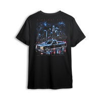 Midnight City Tee back print - black lowered OBS under a neon city skyline