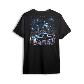Midnight City Tee back print - black lowered OBS under a neon city skyline
