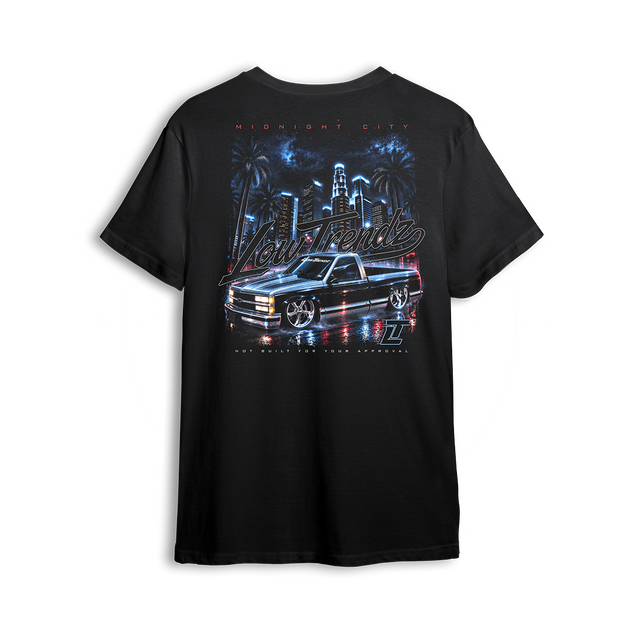 Midnight City Tee back print - black lowered OBS under a neon city skyline
